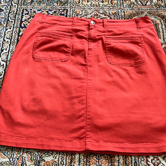 Light orange jean skirt with front and back pockets w/attached stretch shorts. - Picture 1 of 12